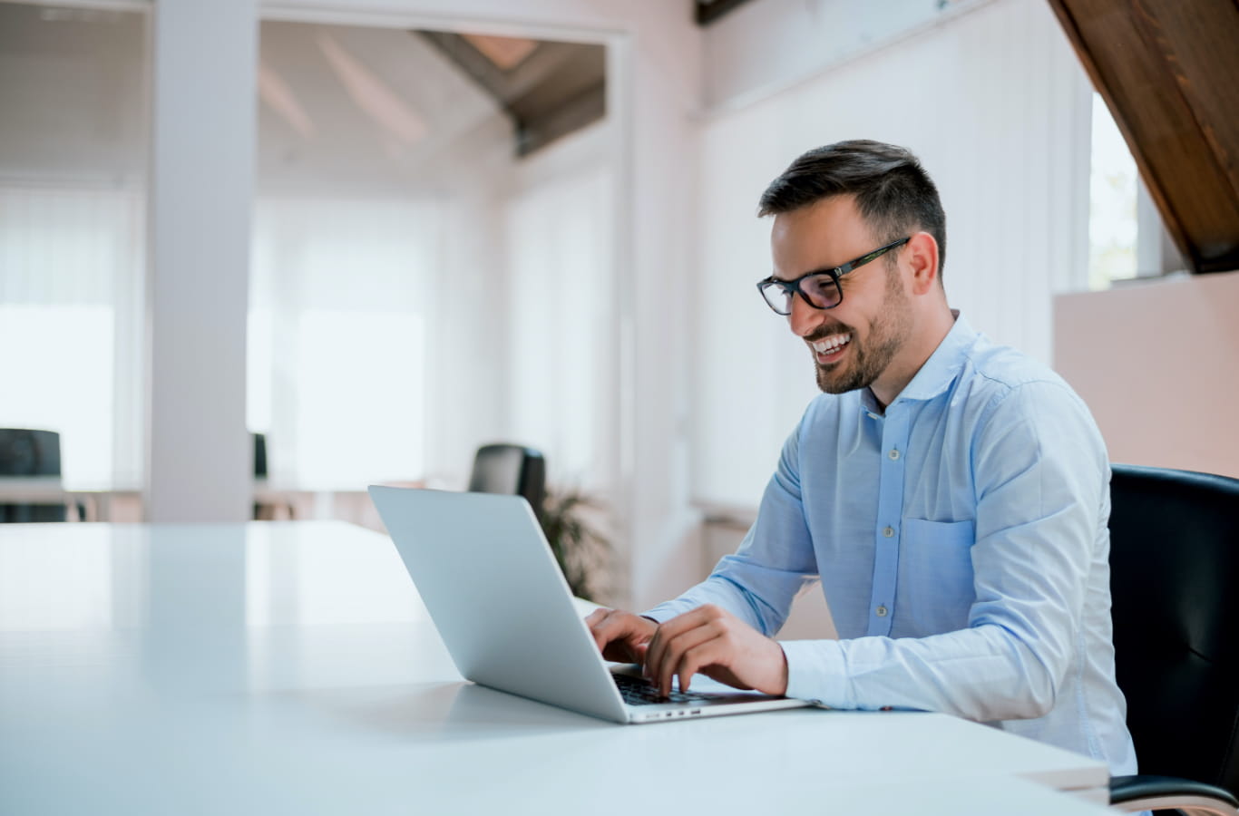 Man using laptop - Accounts receivable automation and cash flow management.